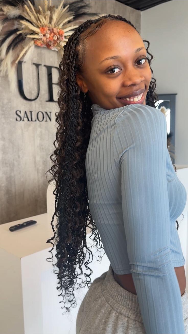 Long curly braided style in the salon