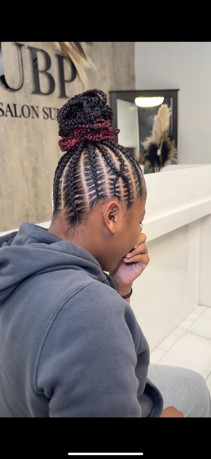 Braided bun style with neat parting